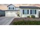 Two-story farmhouse style home with a three-car garage at 19746 W Montecito Ave, Litchfield Park, AZ 85340