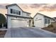 Modern farmhouse exterior with a two-car garage at 19746 W Montecito Ave, Litchfield Park, AZ 85340