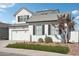 Two-story farmhouse style home with a three-car garage at 19746 W Montecito Ave, Litchfield Park, AZ 85340