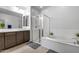 Elegant bathroom with soaking tub and double vanity at 2056 W El Cortez Trl, Phoenix, AZ 85085