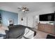 Main bedroom with ensuite bathroom access and TV at 21269 W Haven Dr, Buckeye, AZ 85396