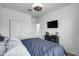 Bright bedroom with double doors and a TV at 21269 W Haven Dr, Buckeye, AZ 85396