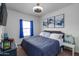Guest bedroom with a comfy bed and blue curtains at 21269 W Haven Dr, Buckeye, AZ 85396