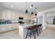 Kitchen with granite island, modern cabinets, and pendant lights at 21269 W Haven Dr, Buckeye, AZ 85396