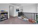 Loft hallway with built-in shelving and carpet at 21269 W Haven Dr, Buckeye, AZ 85396