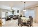 Bright dining area with a round table and gray chairs at 21499 N Greenland Park Dr, Maricopa, AZ 85139