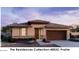 Single-story home with two-car garage and desert landscaping at 22653 W Irma Ln, Surprise, AZ 85387