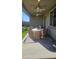 Covered patio with wicker furniture and ceiling fan at 22653 W Irma Ln, Surprise, AZ 85387