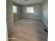 Bright bedroom with wood-look floors and a window at 245 S 56 St # 174, Mesa, AZ 85206