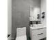 Modern bathroom with floating vanity and concrete accent wall at 2826 N 28Th Pl, Phoenix, AZ 85008