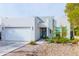 Modern house exterior with a two-car garage and nicely landscaped front yard at 2826 N 28Th Pl, Phoenix, AZ 85008