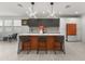 Modern kitchen with an orange island and stainless steel appliances at 2826 N 28Th Pl, Phoenix, AZ 85008