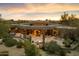 Aerial view of home showcasing its unique architecture and landscaping at 34587 N Ironwood Rd, Scottsdale, AZ 85266