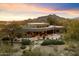 Luxury home with expansive backyard and mountain views at sunset at 34587 N Ironwood Rd, Scottsdale, AZ 85266