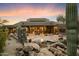 Stunning backyard oasis with a water feature and desert landscaping at 34587 N Ironwood Rd, Scottsdale, AZ 85266