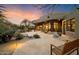 Spacious backyard patio with flagstone, seating area, and desert landscaping at 34587 N Ironwood Rd, Scottsdale, AZ 85266