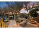 Landscaped backyard with desert plants and mountain views at sunset at 34587 N Ironwood Rd, Scottsdale, AZ 85266