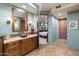 Spa-like bathroom with copper sinks, a large shower, and tile flooring at 34587 N Ironwood Rd, Scottsdale, AZ 85266