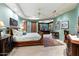 Spacious bedroom with a king-size bed, ensuite bathroom, and sitting area at 34587 N Ironwood Rd, Scottsdale, AZ 85266