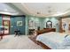 Main bedroom with king bed, ensuite bath, and access to a private patio at 34587 N Ironwood Rd, Scottsdale, AZ 85266