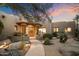 Stunning home exterior with desert landscaping and stone pathway at 34587 N Ironwood Rd, Scottsdale, AZ 85266