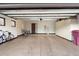 Spacious garage with overhead storage and epoxy flooring at 34587 N Ironwood Rd, Scottsdale, AZ 85266