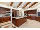 Gourmet kitchen features a large island, stainless steel appliances, and custom cabinetry at 34587 N Ironwood Rd, Scottsdale, AZ 85266