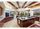 Spacious kitchen with large island, granite countertops, and wooden cabinets at 34587 N Ironwood Rd, Scottsdale, AZ 85266