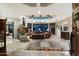 Spacious living area with a stone fireplace and views to the backyard at 34587 N Ironwood Rd, Scottsdale, AZ 85266