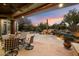 Covered patio with seating area and a view of the desert landscape at 34587 N Ironwood Rd, Scottsdale, AZ 85266