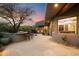 Outdoor kitchen and patio area with seating and desert landscaping at 34587 N Ironwood Rd, Scottsdale, AZ 85266