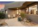 Relaxing patio with seating area, stone pathway, and desert landscaping at 34587 N Ironwood Rd, Scottsdale, AZ 85266