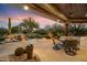 Covered patio with a dining area and mountain views at 34587 N Ironwood Rd, Scottsdale, AZ 85266