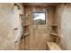 Spa-like shower with multiple shower heads and built-in seating at 34587 N Ironwood Rd, Scottsdale, AZ 85266