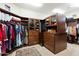 Large walk-in closet with ample shelving and hanging space at 34587 N Ironwood Rd, Scottsdale, AZ 85266