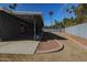 View of large backyard with covered patio at 353 Ancora S Dr, Litchfield Park, AZ 85340