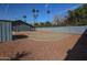 Wide open backyard featuring desert landscaping and mature palm trees at 353 Ancora S Dr, Litchfield Park, AZ 85340