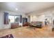 Spacious living room featuring Saltillo tile flooring, neutral walls, and natural light at 36448 N Wildflower Rd, Carefree, AZ 85377