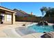 Relaxing pool area with waterfall feature and ample space for lounging at 4041 E Milton Dr, Cave Creek, AZ 85331