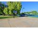 Community basketball court with tennis court in background at 4222 E Mclellan Cir # 7, Mesa, AZ 85205