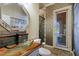 Modern bathroom with glass sink, wood vanity, and patterned wallpaper at 4222 E Mclellan Cir # 7, Mesa, AZ 85205