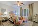 Elegant bedroom with plush bedding, stylish seating, and large windows at 4222 E Mclellan Cir # 7, Mesa, AZ 85205