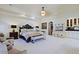 Large bedroom with plush carpet, fireplace, and built-in bar at 4222 E Mclellan Cir # 7, Mesa, AZ 85205