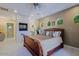 King-size bed with fireplace and en-suite bathroom at 4222 E Mclellan Cir # 7, Mesa, AZ 85205