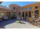 Charming courtyard with a fountain, seating area, and lush landscaping at 4222 E Mclellan Cir # 7, Mesa, AZ 85205