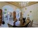 Bright dining room with large windows and elegant chandelier at 4222 E Mclellan Cir # 7, Mesa, AZ 85205
