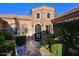 Elegant entryway with stone accents and wrought iron door at 4222 E Mclellan Cir # 7, Mesa, AZ 85205