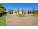 Luxury home exterior with a large driveway and manicured lawn at 4222 E Mclellan Cir # 7, Mesa, AZ 85205