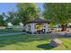Relaxing gazebo surrounded by lush trees and landscaping at 4222 E Mclellan Cir # 7, Mesa, AZ 85205