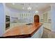 Island kitchen with wood countertop and custom cabinetry at 4222 E Mclellan Cir # 7, Mesa, AZ 85205